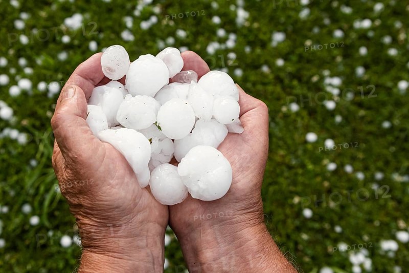 Golfball-sized hailstones in hands