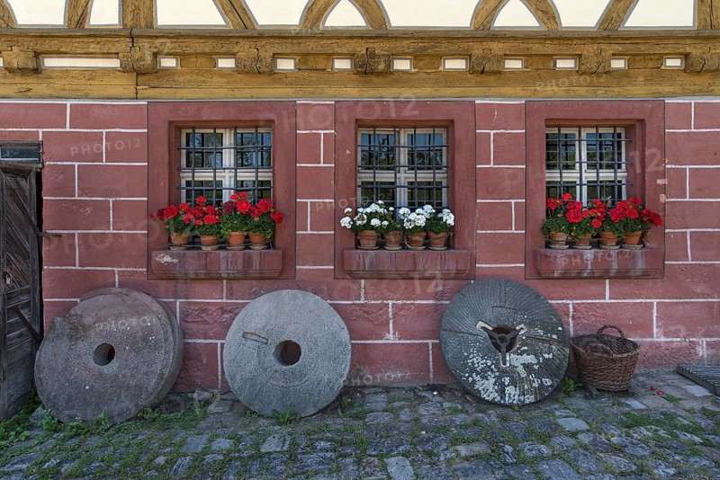 Old millstones in front of the flour mill