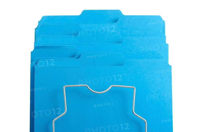 Blue file folders in rack isolated on a white background. labels ready for your own text