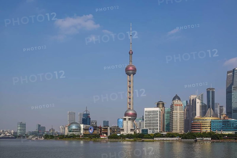 View over the Huangpu River to the skyline of the special economic zone Pudong with Oriental Pearl Tower