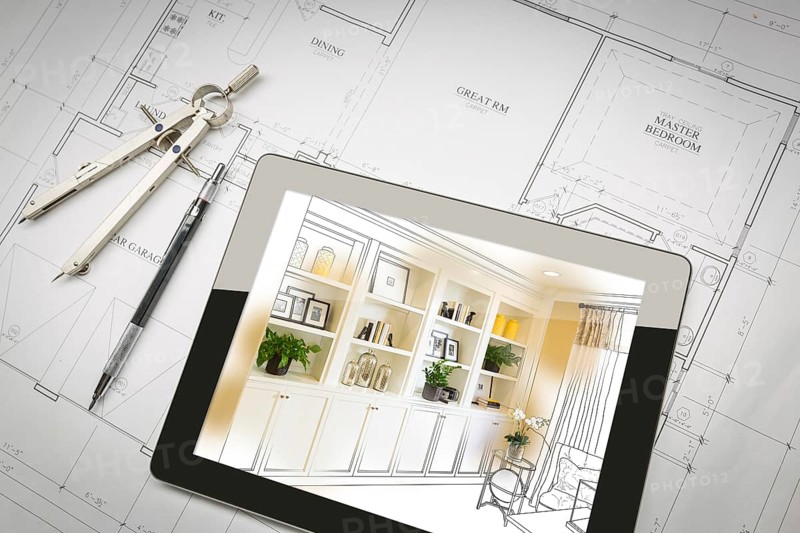 Computer tablet with finished built-in shelves and cabinets over house plans