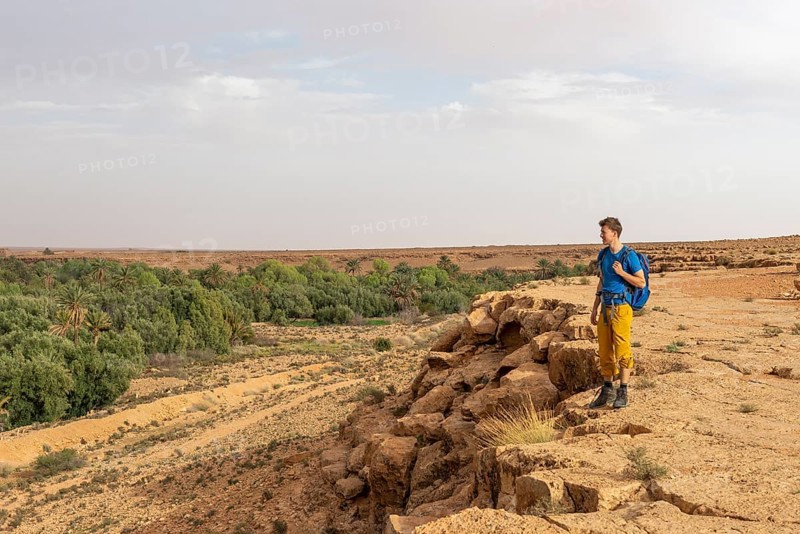 Young man at a cliff edge