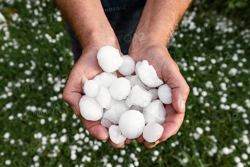 Golfball-sized hailstones in hands