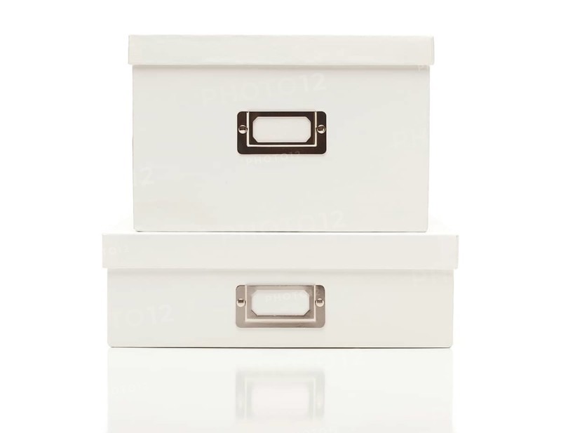 Stacked blank white file boxes with lids isolated on a white background ready for your own message