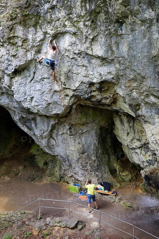 Climber at rock face in Riesenburg cave