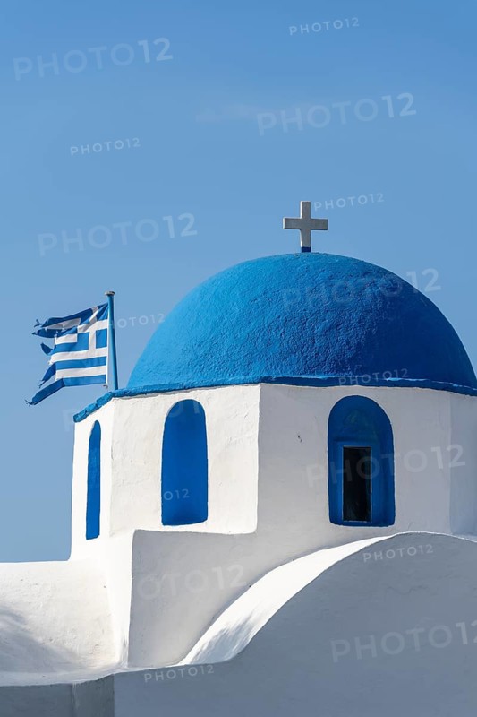 Blue and White Greek Orthodox Church Agios Nikolaos with Greek Flag
