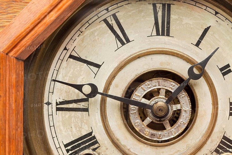 Worn vintage antique clock face and mechanism