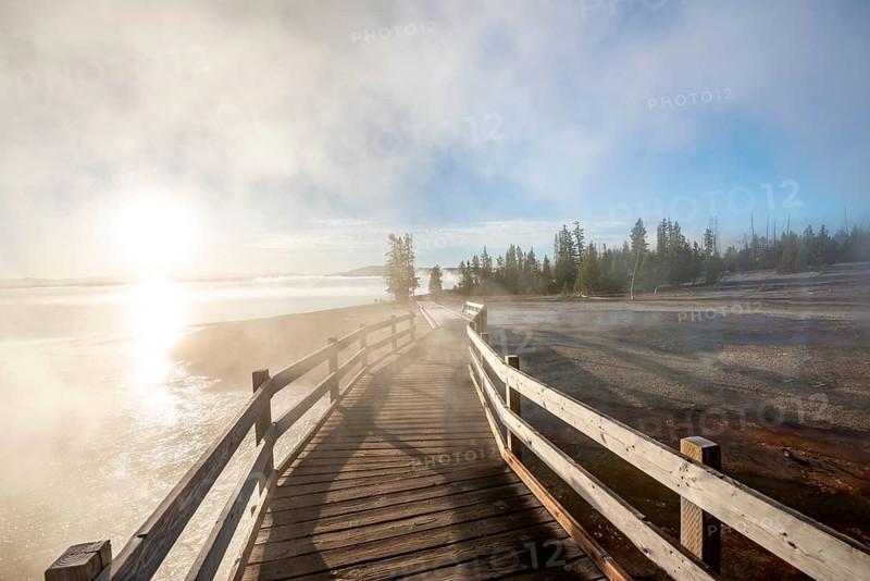 Boardwalk between steaming hot springs