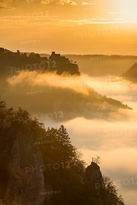 View from Eichfelsen to Werenwag Castle with morning fog