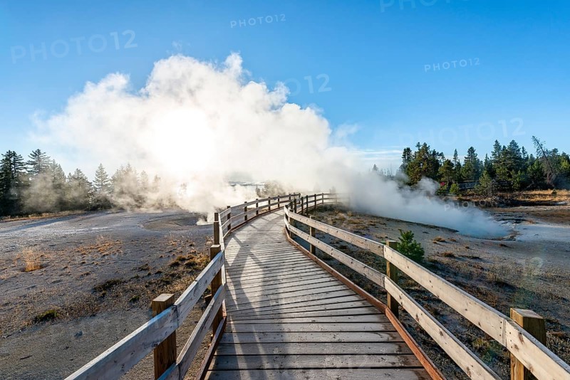 Boardwalk between steaming hot springs