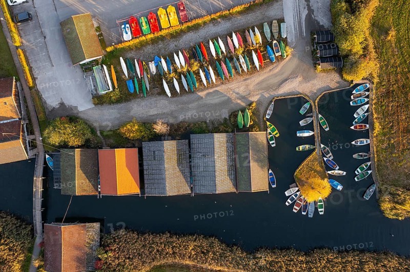 Boats and boathouses in the harbour from above