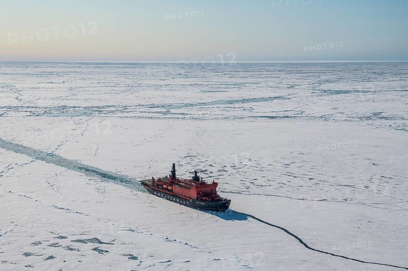 Aerial of the Icebreaker '50 years of victory' on its way to the North Pole breaking through the ice