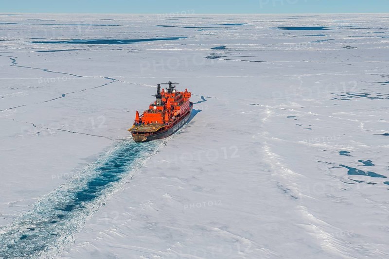 Aerial of the Icebreaker '50 years of victory' on its way to the North Pole breaking through the ice