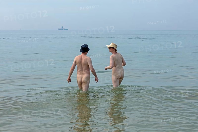Elderly couple bathing naked