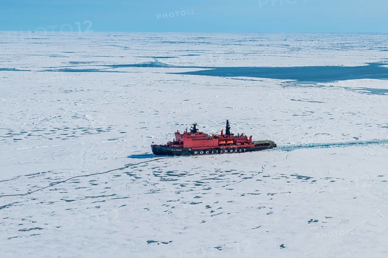 Aerial of the Icebreaker '50 years of victory' on its way to the North Pole breaking through the ice