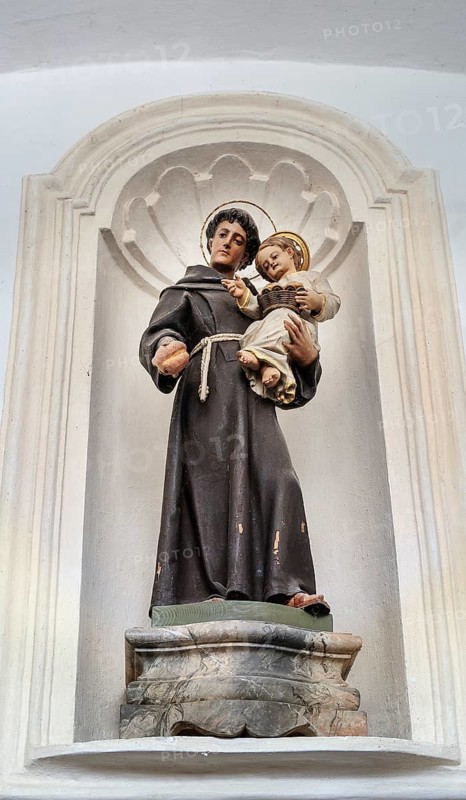 Saint figure with Jesus child and bread
