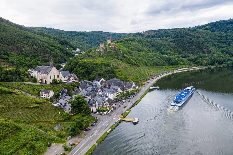 Cruise ship passing Beilstein on the Moselle with Metternich castle