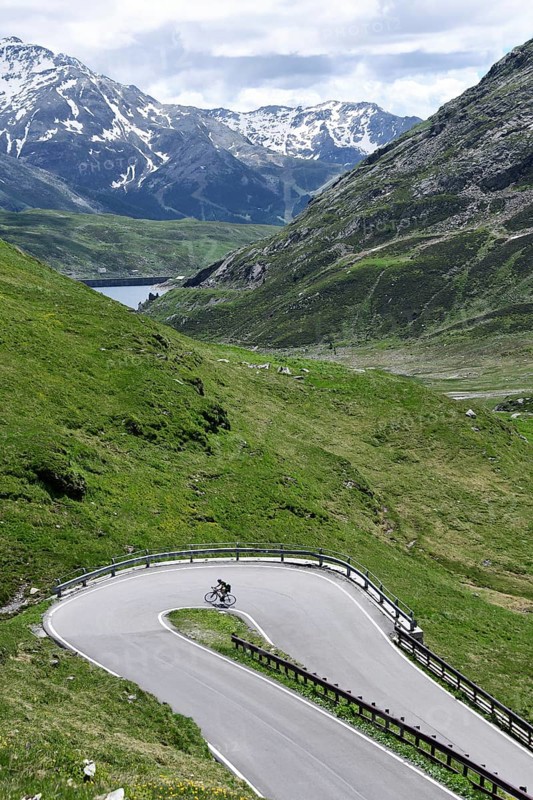 Road cyclist on the south side of the Spluegen Pass