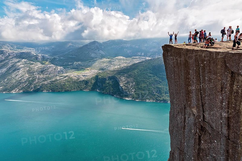Hiker on rocky peak Preikestolen