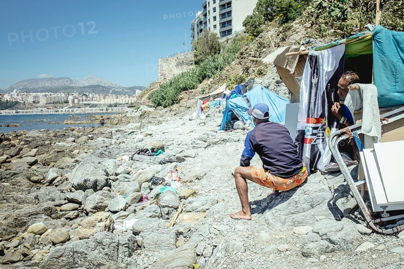 Tents and self-constructed huts on the cliff