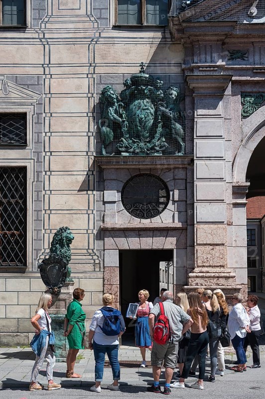West front of the Residenz with tourist group during city tour