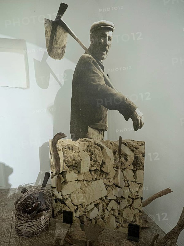 Worker with stones for trulli houses