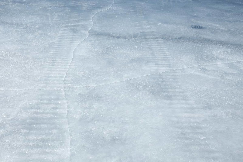 Frozen snowmobile prints