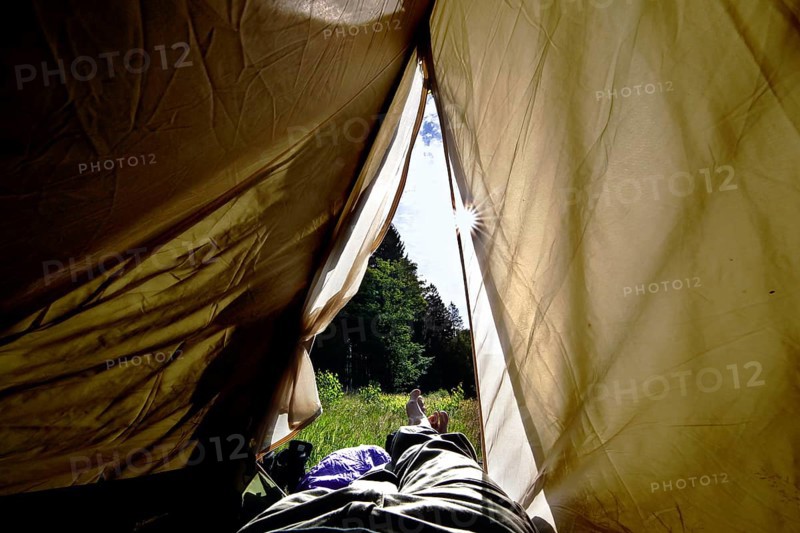 Legs peeping out of tent