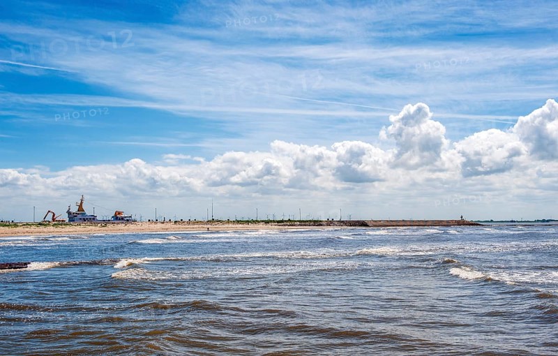 Sandy beach beach at the pier of the ferry line Nessmersiel-Baltrum