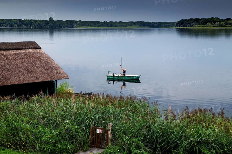 Angler with boat in the Schaalsee