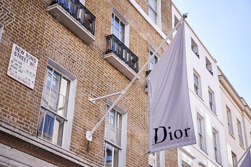 Dior flag on old house wall