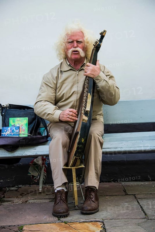 Man playing the traditional Bandura instrument