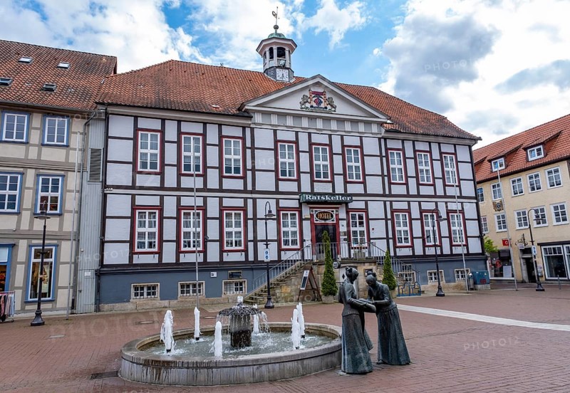 Sculpture of two linen weavers at the fountain in front of the town hall in Luechow