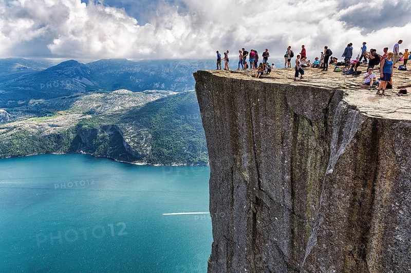 Hiker on rocky peak Preikestolen