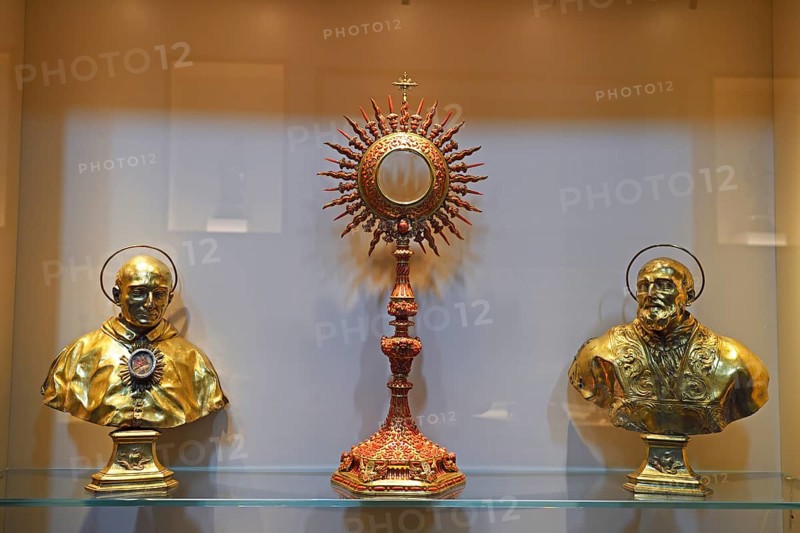 Golden monstrance and holy figures