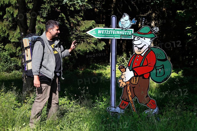Hiker and sign Wetzsteinhuette