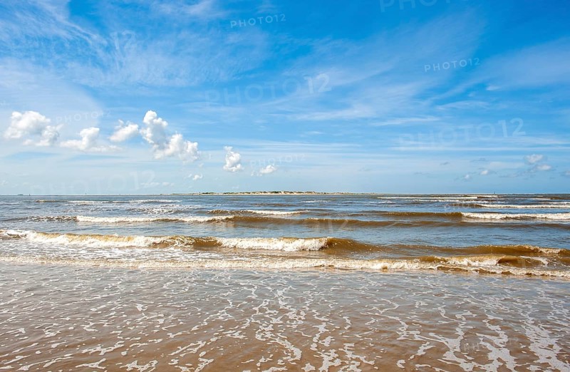 Sandy beach beach at the harbour of the island Baltrum
