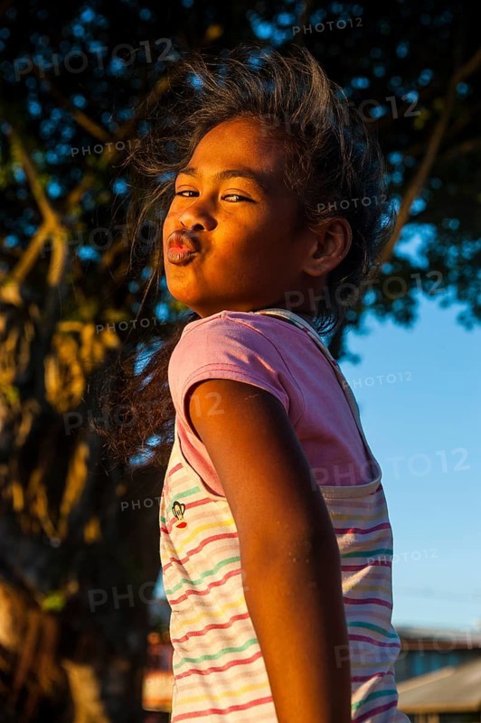 Young girl posing as western actors