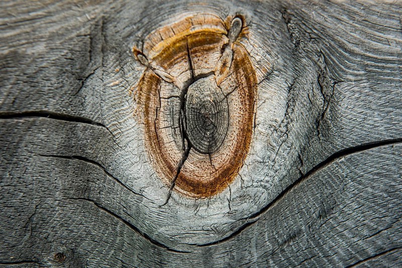 Weathered wood with knothole at an alpine hut