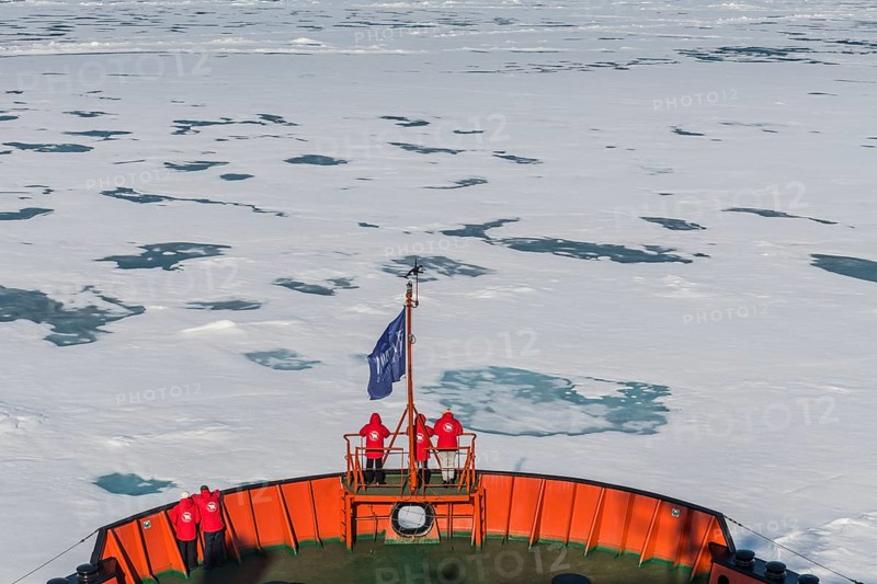 Tourists watching the ice breaking on board of an icebreaker