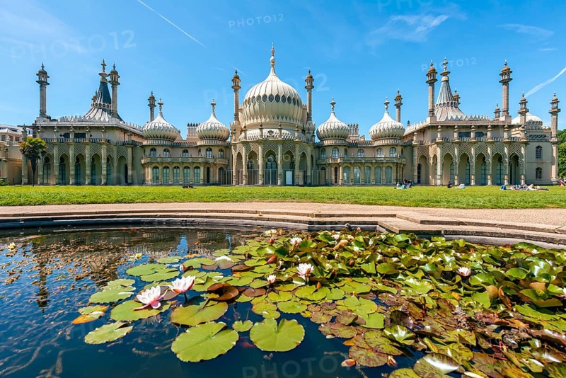 Royal Pavilion palace reflected with a pond with water lilies