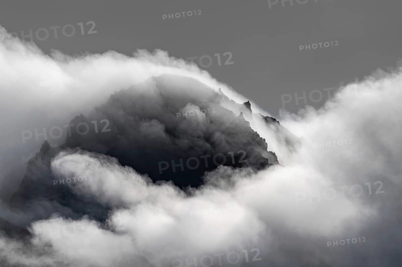 Cloudy craggy mountain