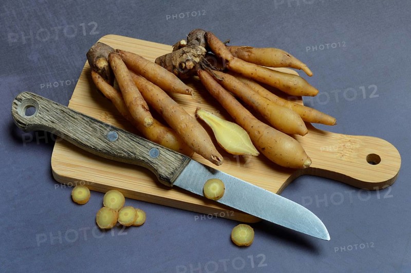 Fingerroot and knife on cutting board