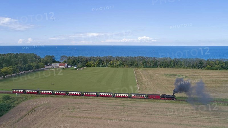 Steam train Molli at the sea buckthorn beach