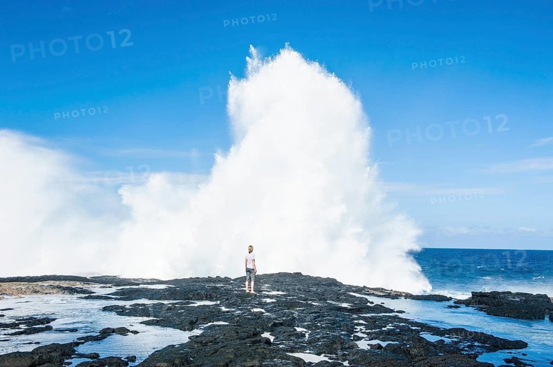 Tourist enjoying the huge waves in the Alofaaga blowholes on the south of SavaiÂ´i