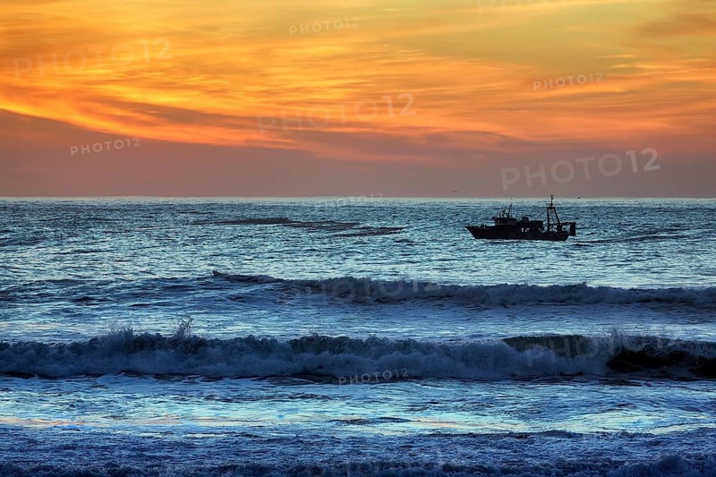 Fishing boat in the surf