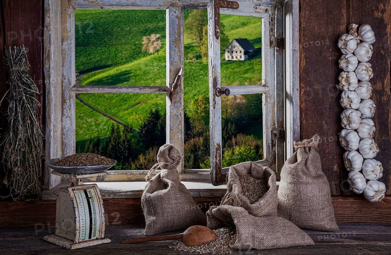 View from the farmer's kitchen with grain sacks and scales into the landscape