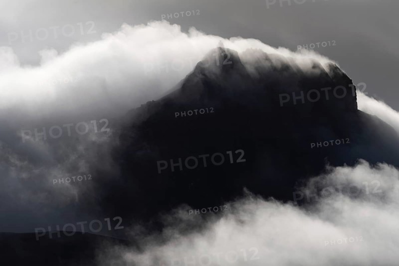 Cloudy craggy mountain