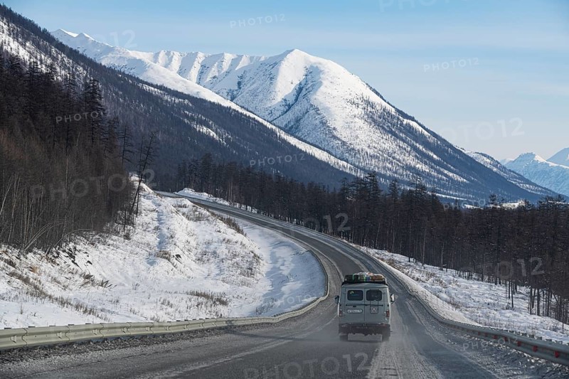 Minivan driving on the Road of Bones