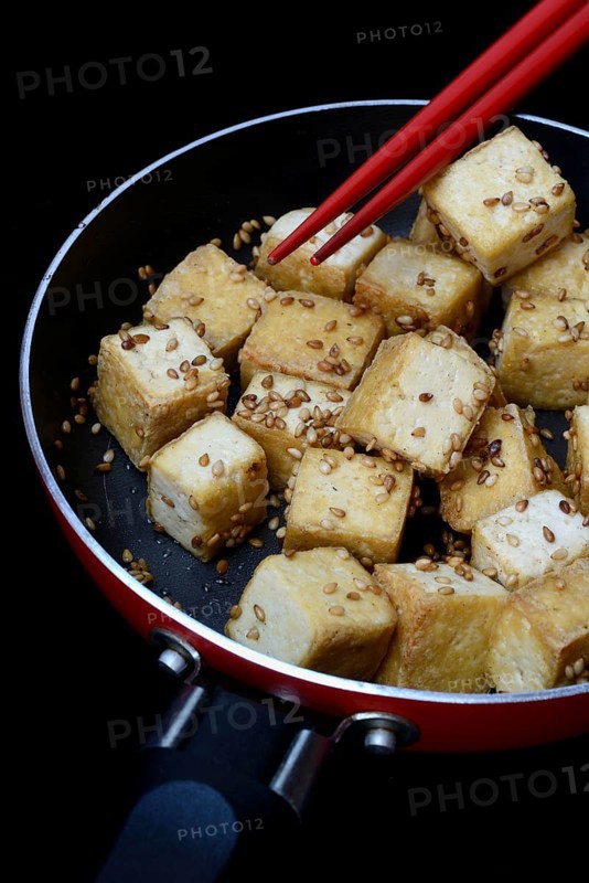 Fried tofu cubes in pan